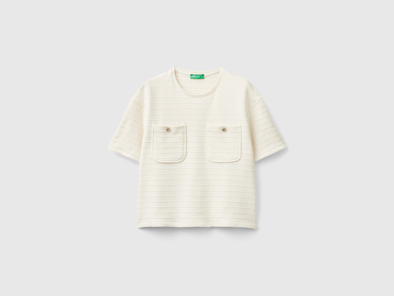 Maglietta girocollo con taschini da donna bianco panna | Benetton Outlet