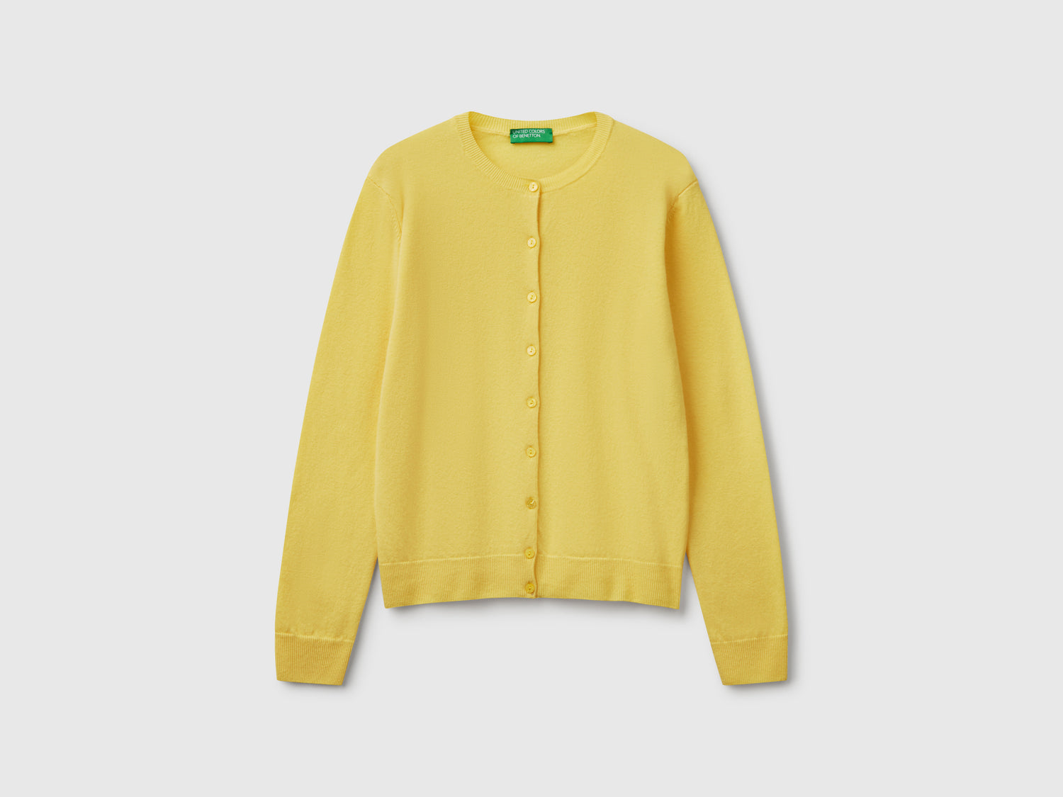 Crew neck cardigan in pure Merino wool da donna giallo | Benetton Outlet