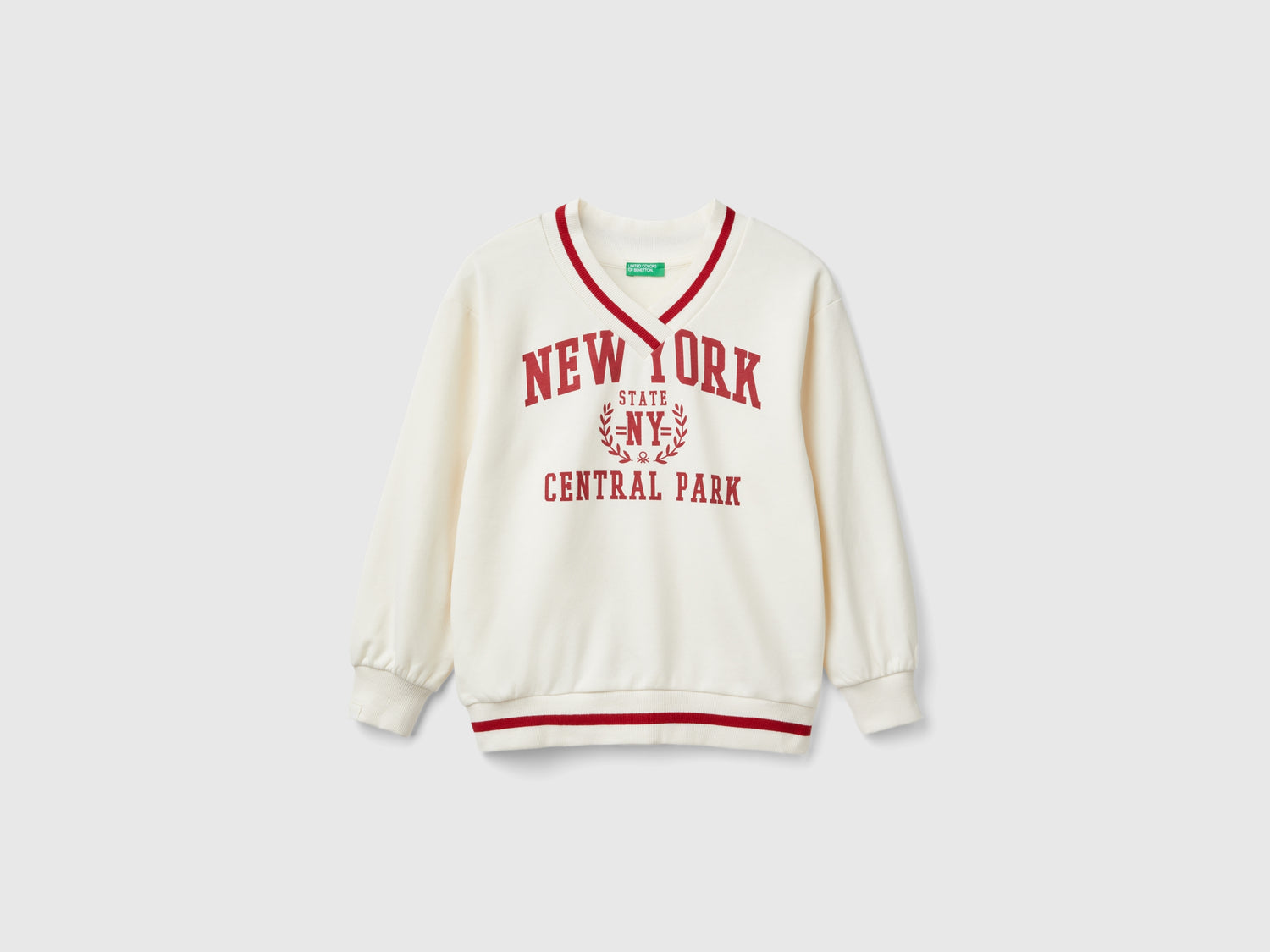 V-neck sweatshirt da bambina bianco panna | Benetton Outlet