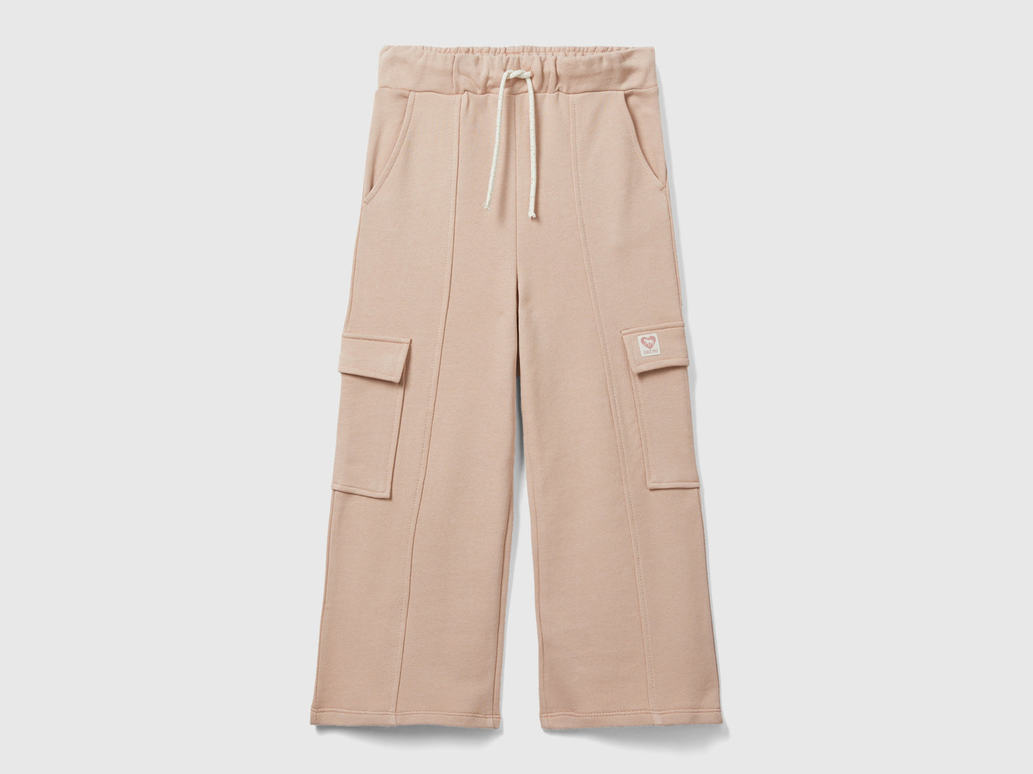 Pantaloni ampi in felpa da bambina rosa tenue | Benetton Outlet