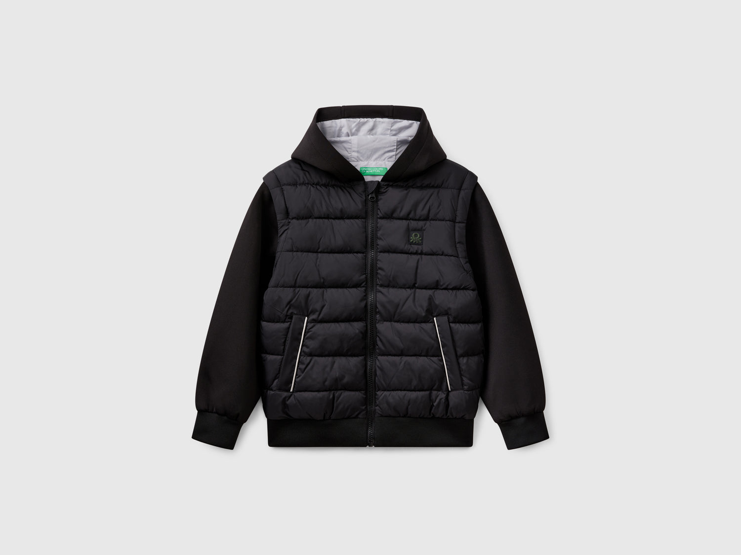 Giubbino con maniche staccabili da bambino nero | Benetton Outlet