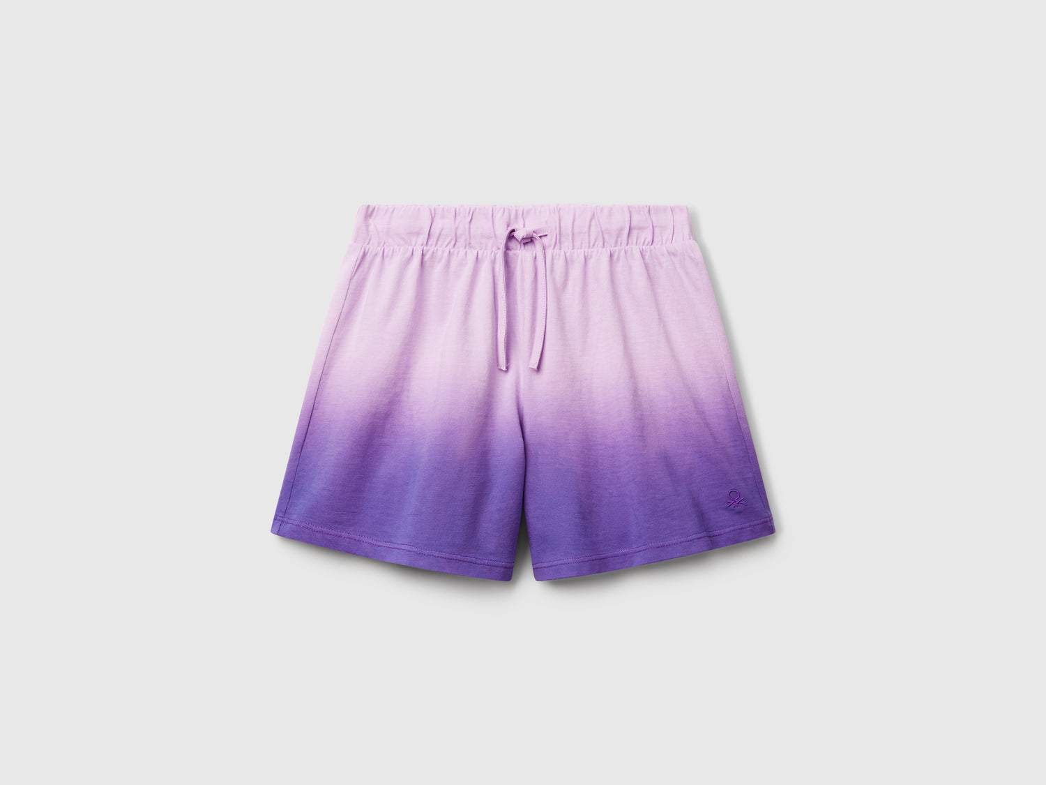 Shorts dip-dye da bambina viola | Benetton Outlet