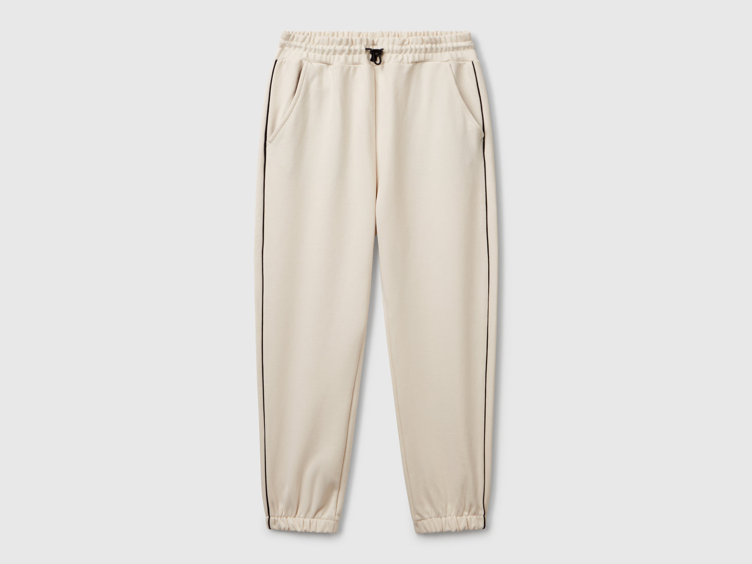 Pantaloni in felpa con piping da bambino beige | Benetton Outlet