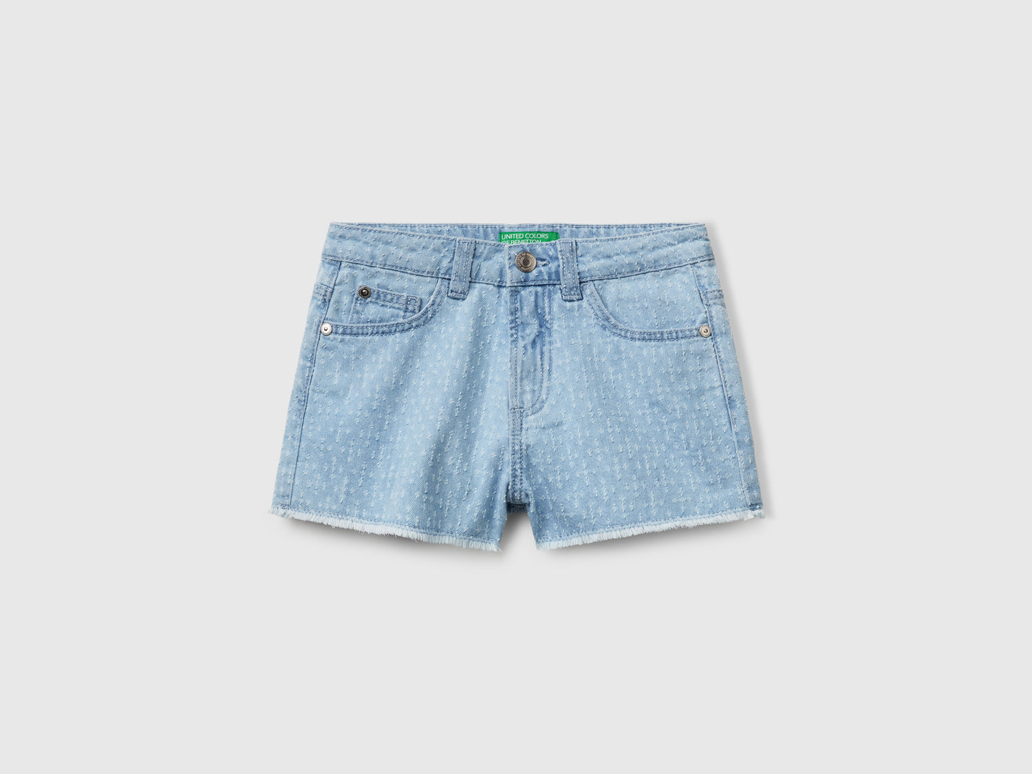 Pantaloni corti di jeans con sfrangiatura da bambina azzurro | Benetton Outlet