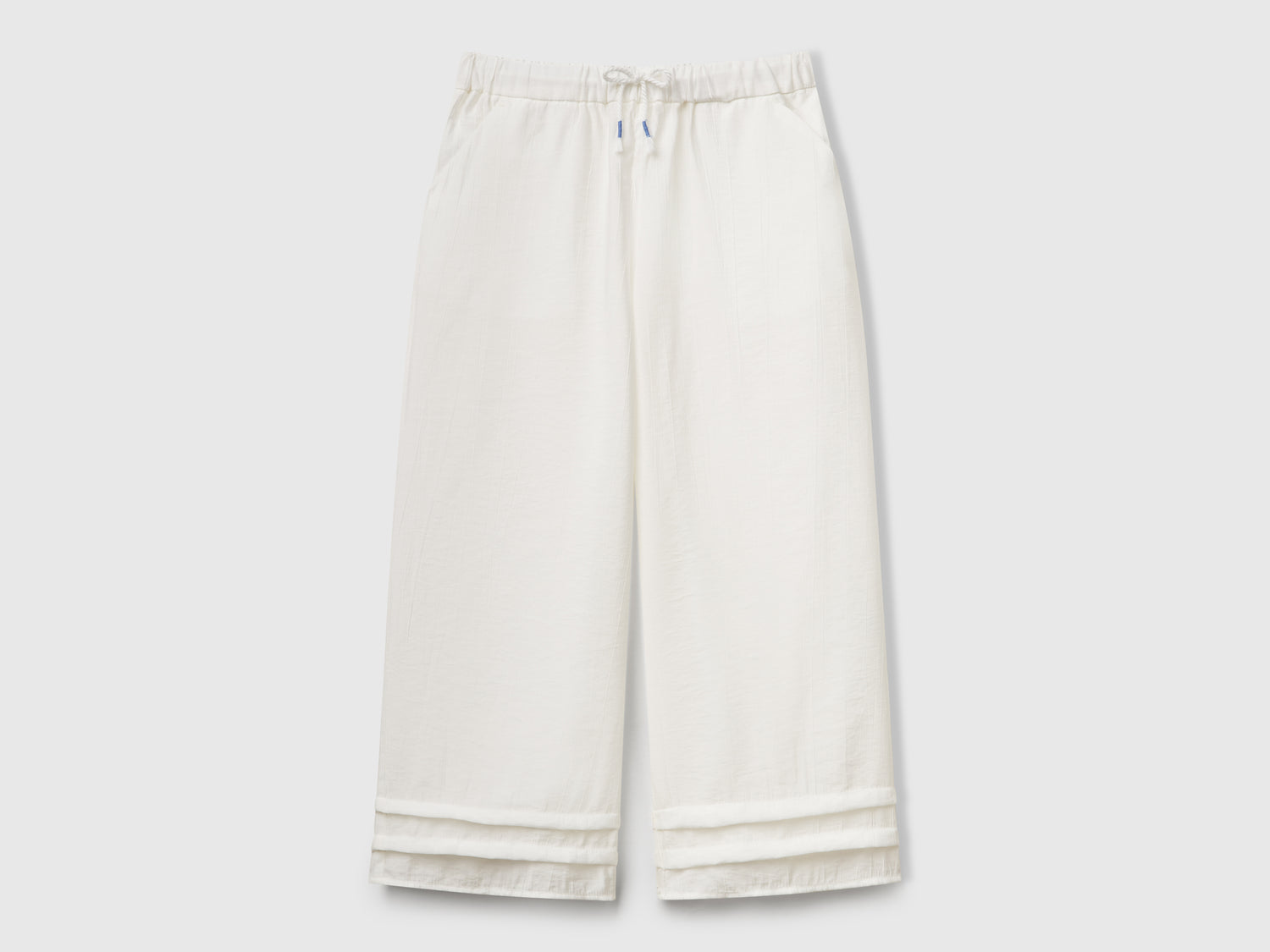 Pantaloni in misto viscosa da bambina bianco panna | Benetton Outlet