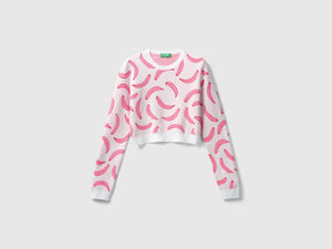 Maglia cropped rosa chiaro con pattern banane