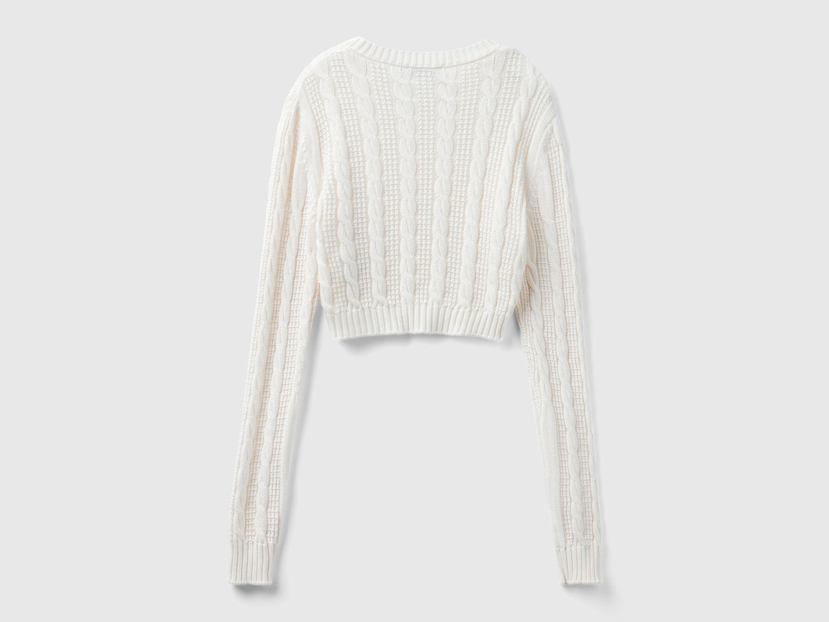Cropped cable knit sweater