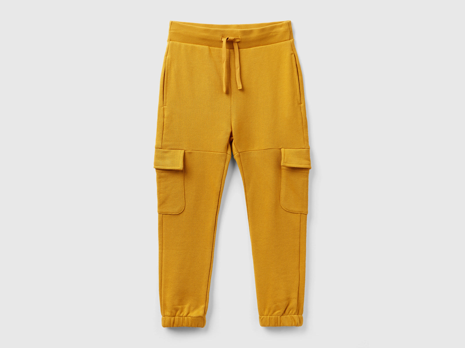 Pantaloni cargo in felpa da bambino senape | Benetton Outlet