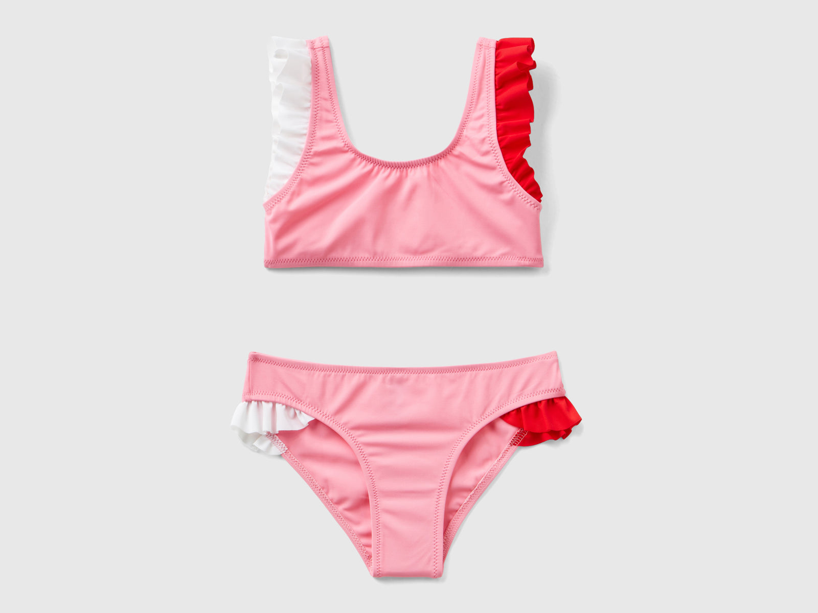 Bikini mare con volant in ECONYL® da bambina rosa | Benetton Outlet