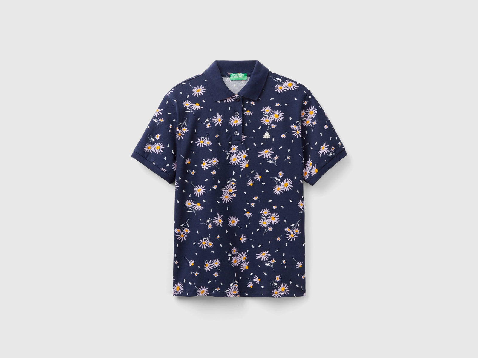 Polo with daisy print da donna blu scuro | Benetton Outlet