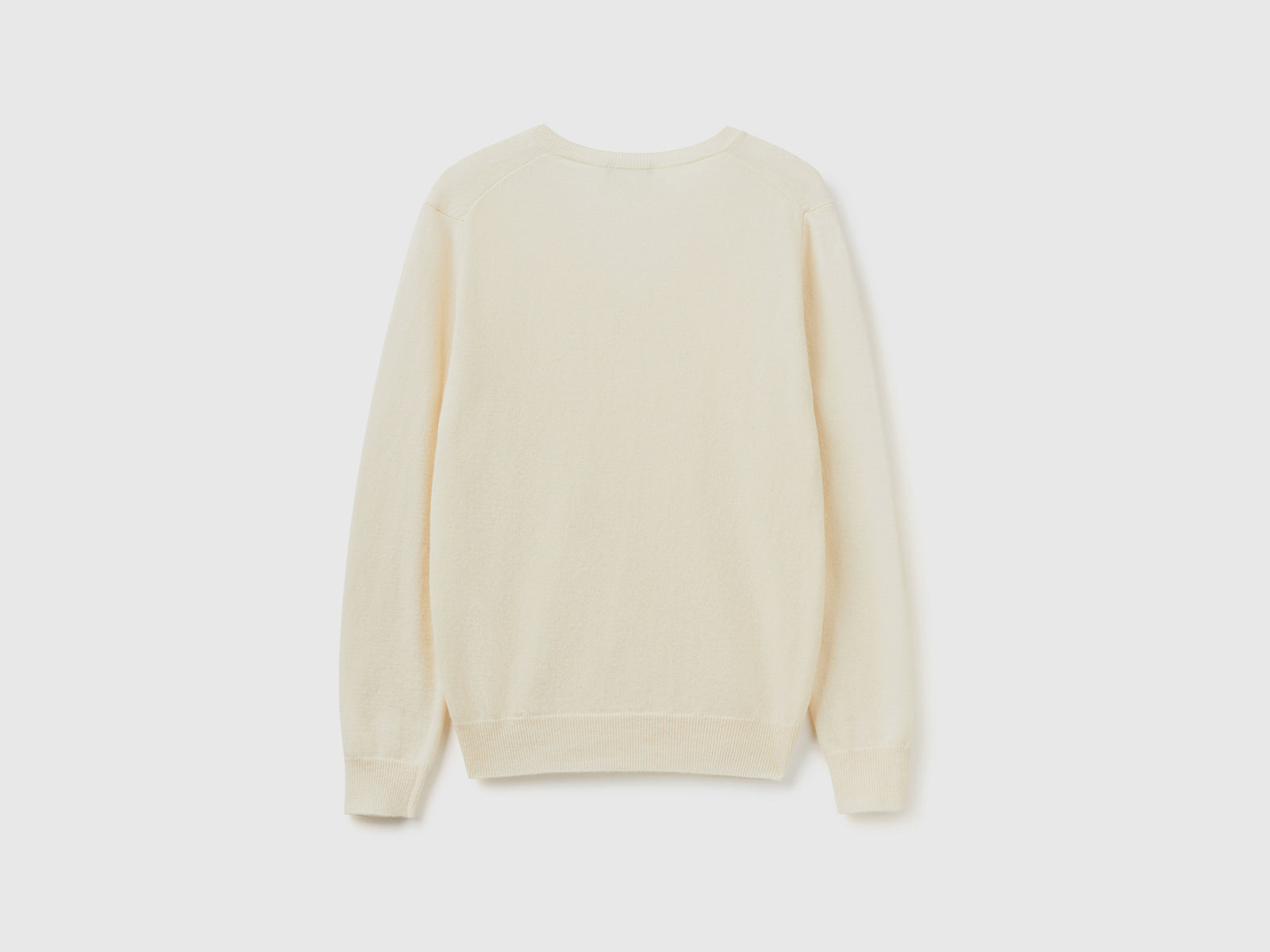 Maglia con scollo a V panna in pura lana Merino da donna bianco panna 2 | Benetton Outlet