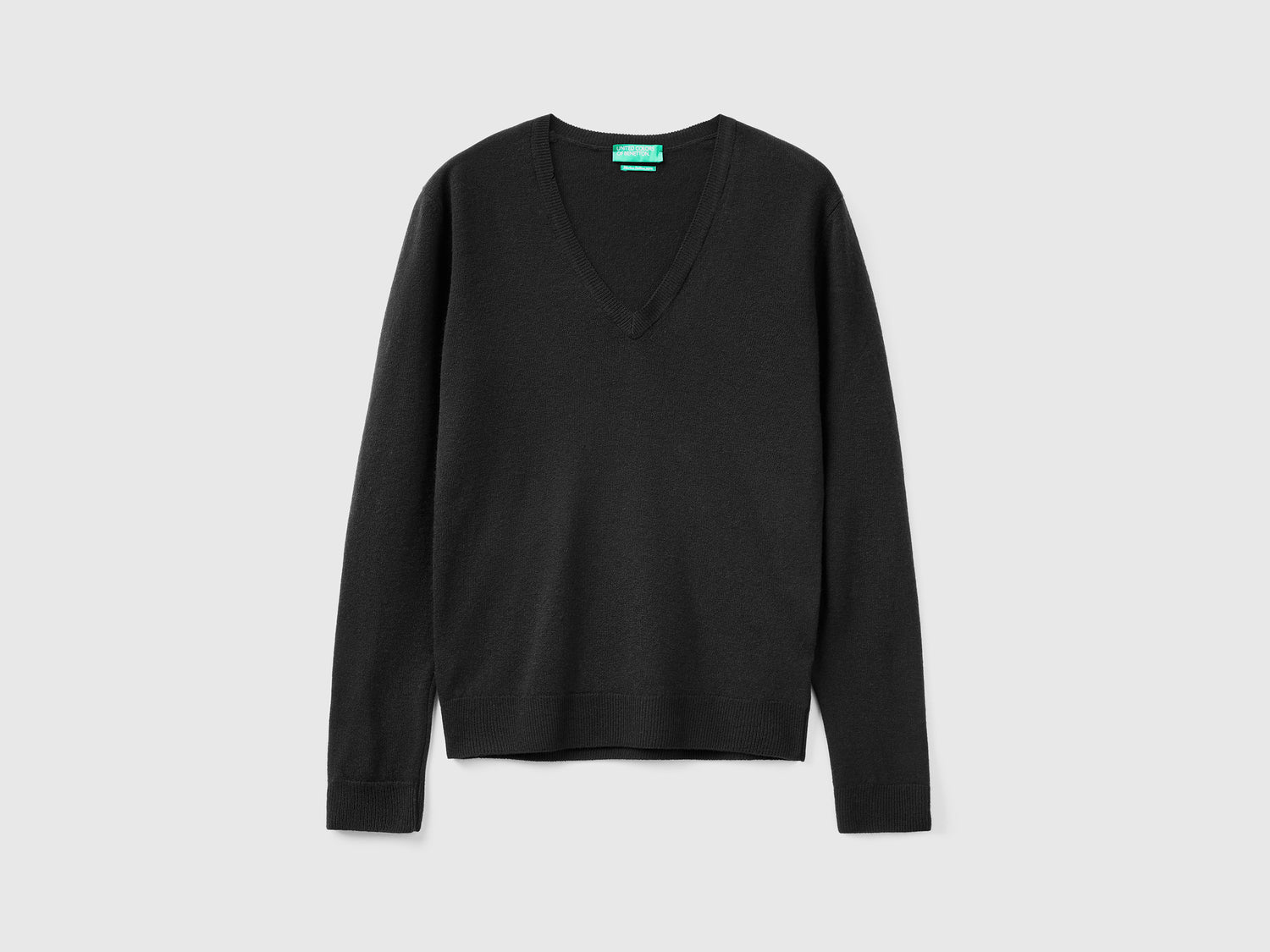 Maglia con scollo a V in pura lana Merino da donna nero | Benetton Outlet