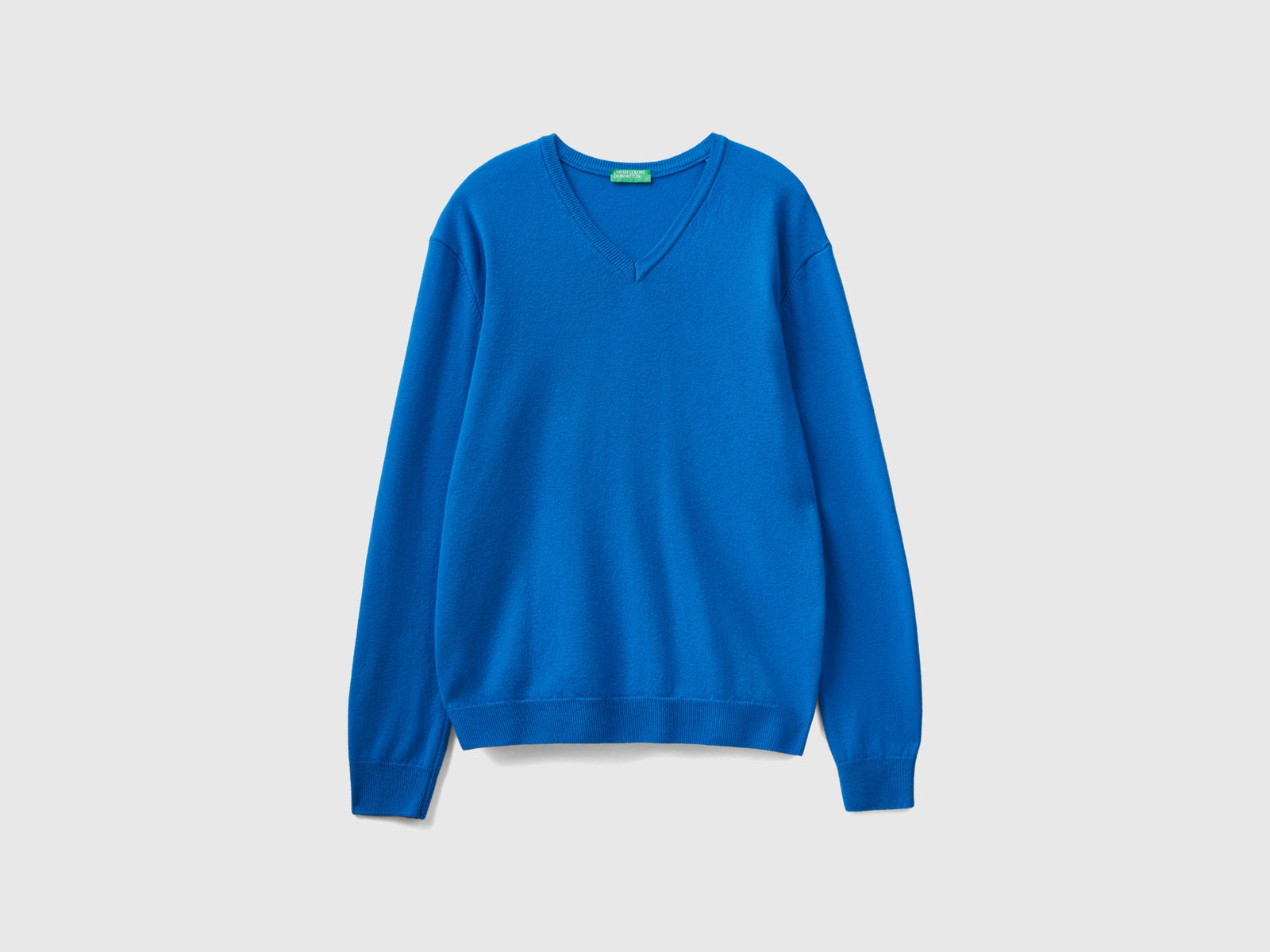 Maglia scollo a V in pura lana Merino da uomo bluette | Benetton Outlet
