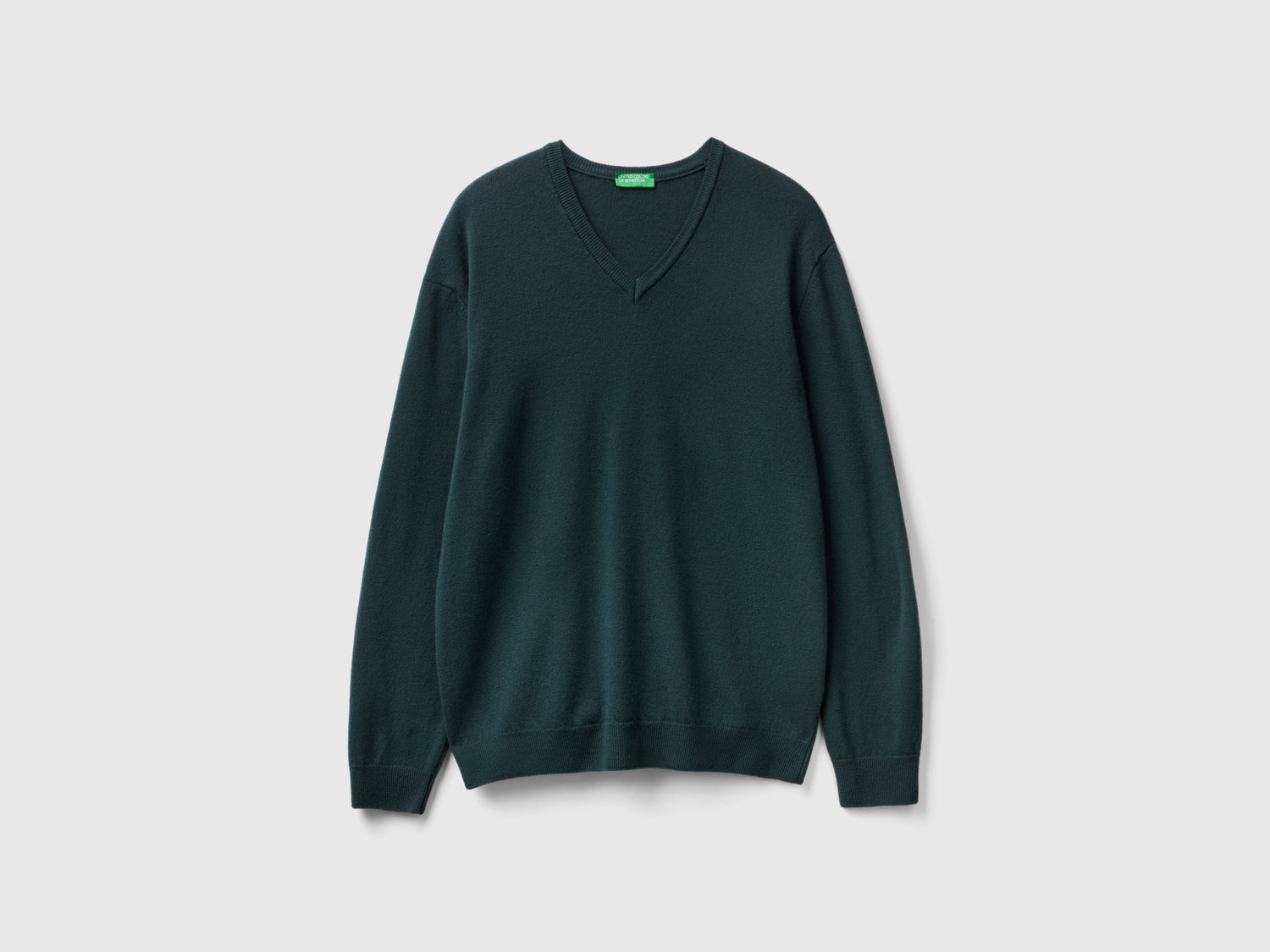 Maglia scollo a V in pura lana Merino da uomo verde scuro | Benetton Outlet