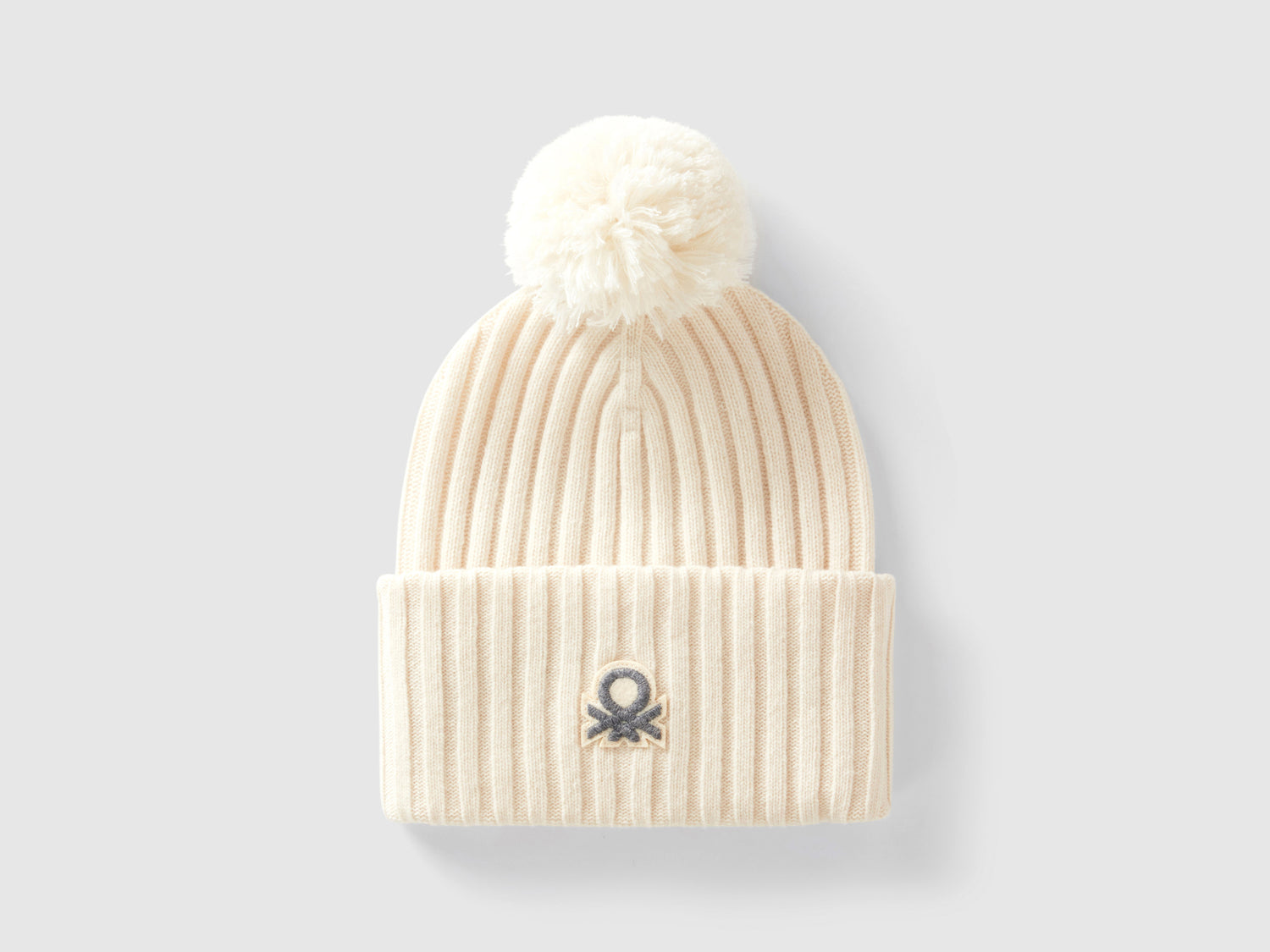 Berretto con logo e pom pom da donna bianco panna | Benetton Outlet