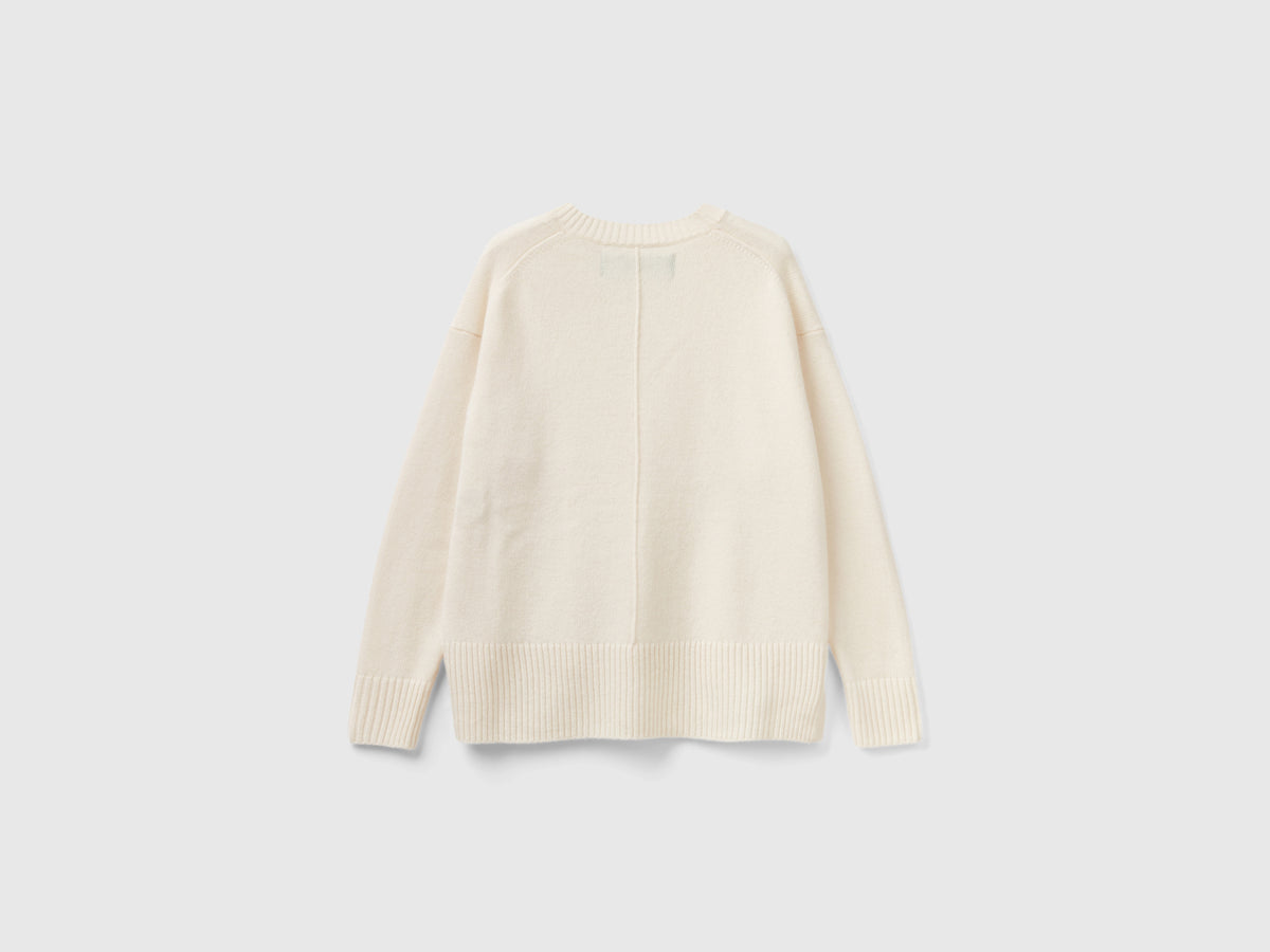 Maglione over fit con spacchi