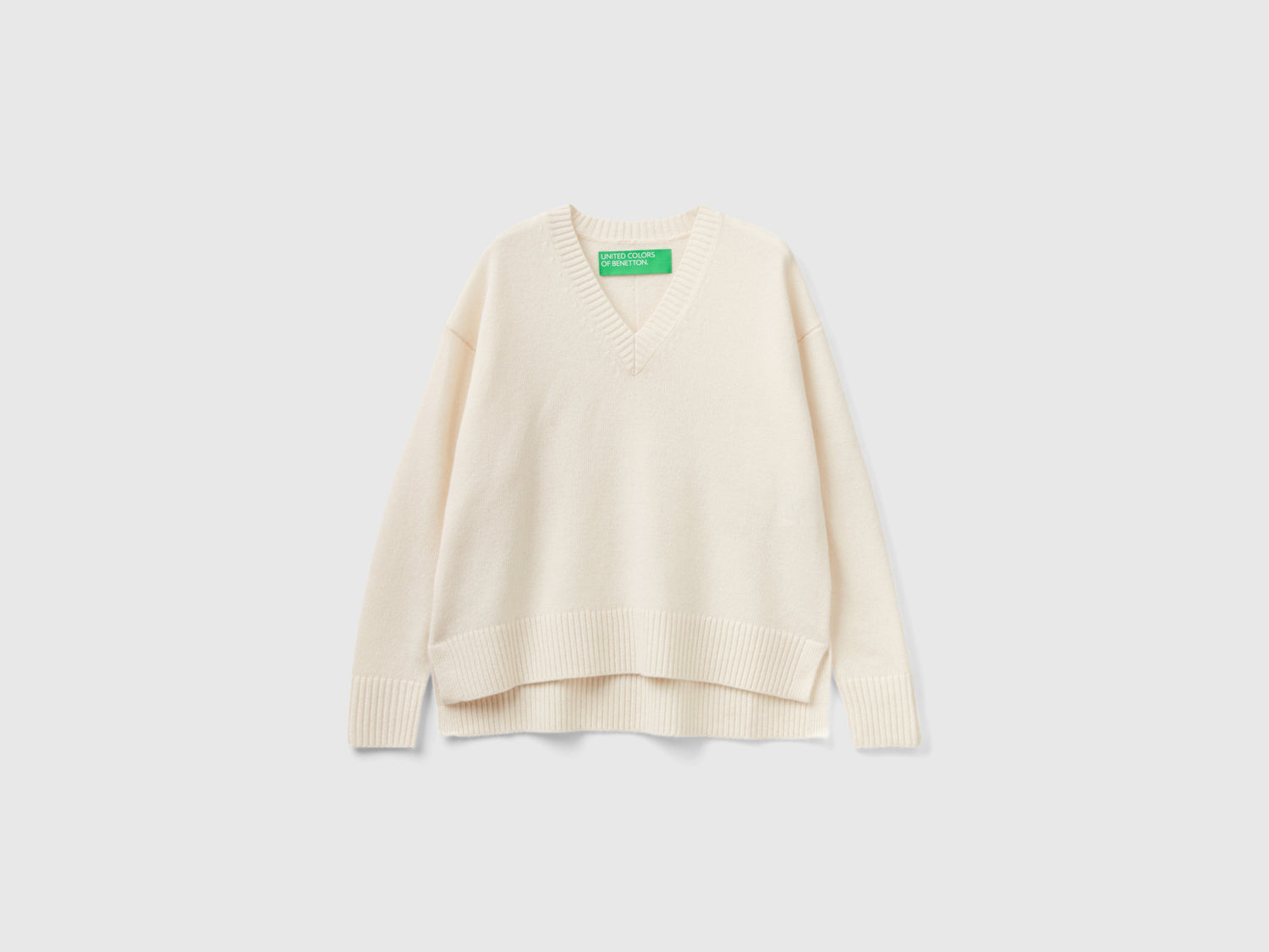 Maglione over fit con spacchi da donna bianco panna | Benetton Outlet