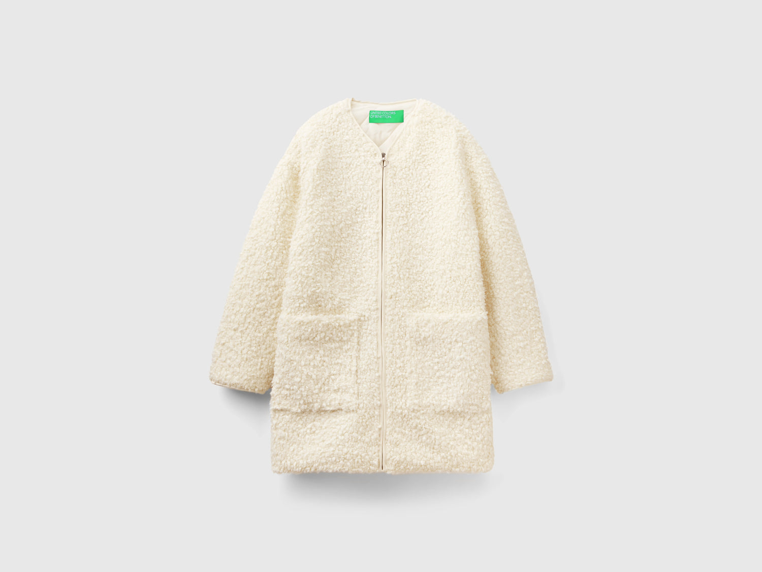 Cappotto teddy in pelliccetta sintetica da donna bianco panna | Benetton Outlet