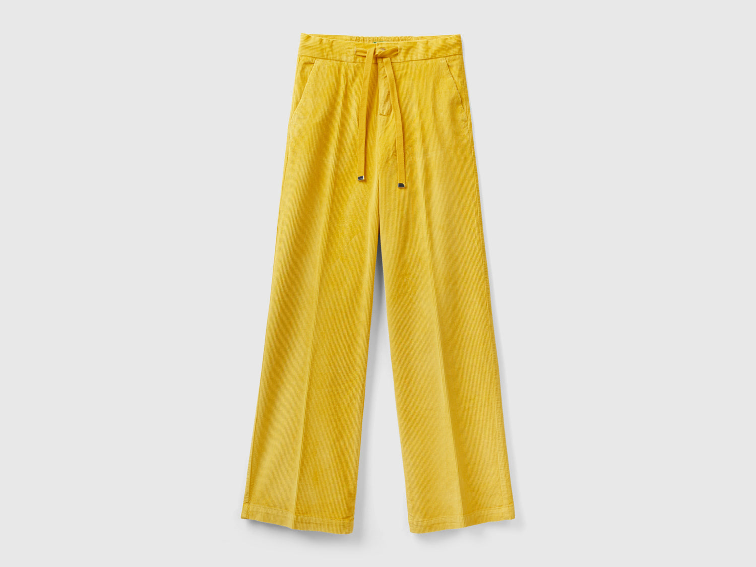 Pantaloni ampi in velluto da donna giallo | Benetton Outlet