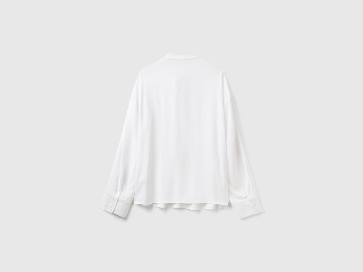 Blusa fluida con lacci