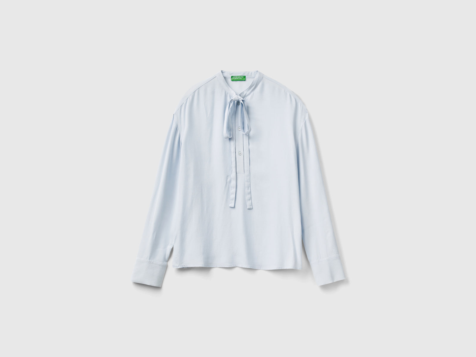 Blusa fluida con lacci da donna celeste | Benetton Outlet