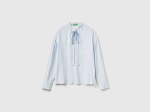 Blusa fluida con lacci