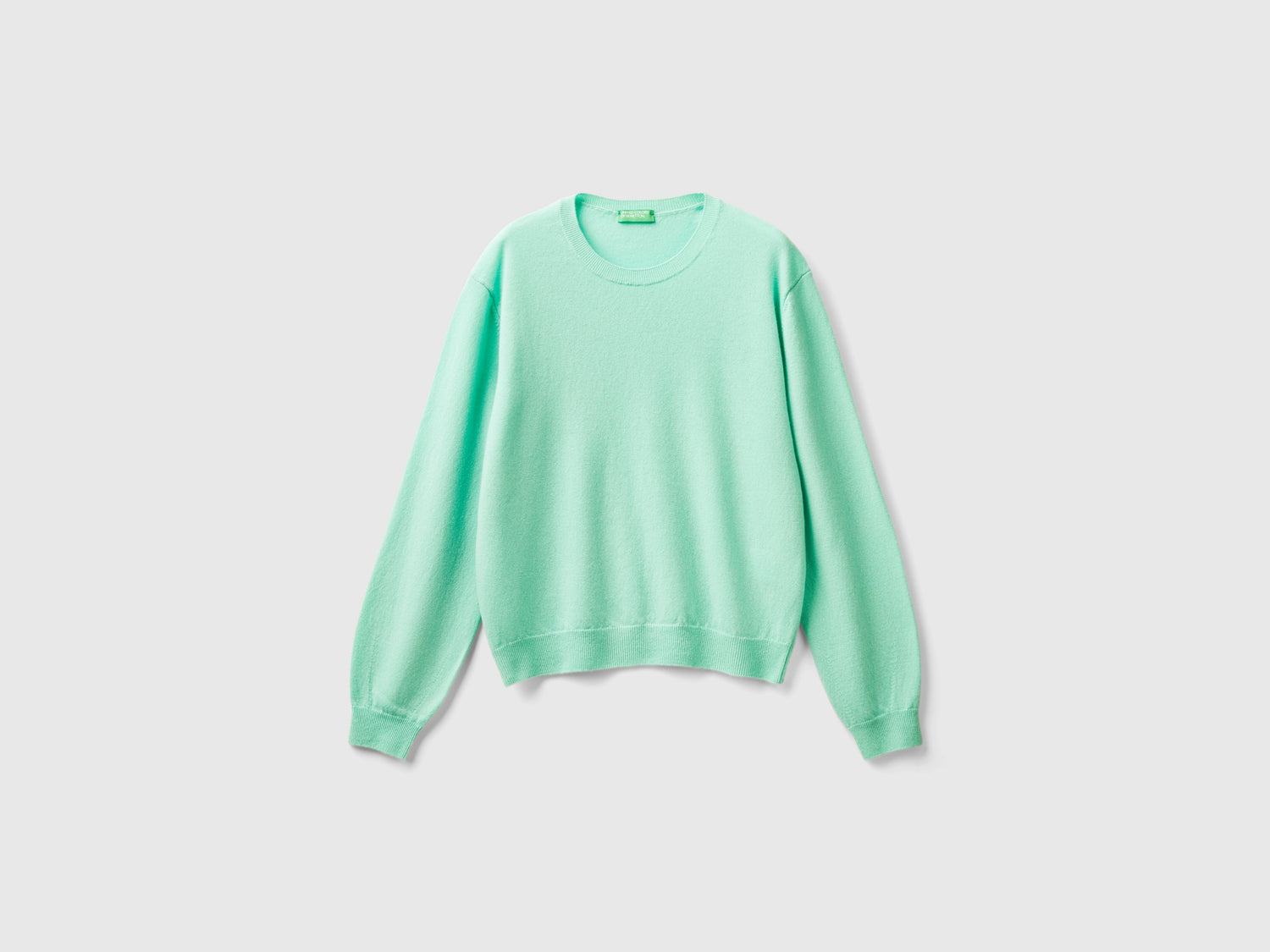 Maglia relaxed fit in pura lana Merino da donna verde acqua | Benetton Outlet