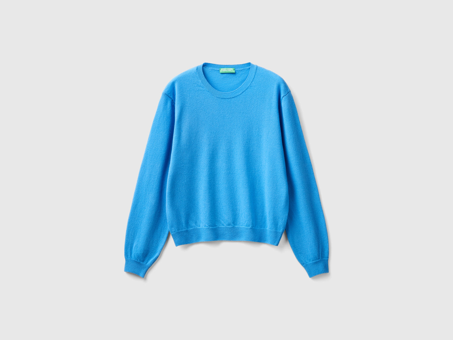 Maglia relaxed fit in pura lana Merino da donna azzurro | Benetton Outlet