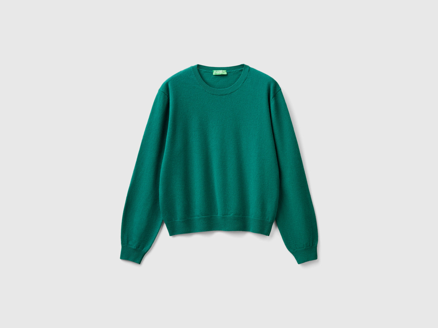 Maglia relaxed fit in pura lana Merino da donna verde scuro | Benetton Outlet