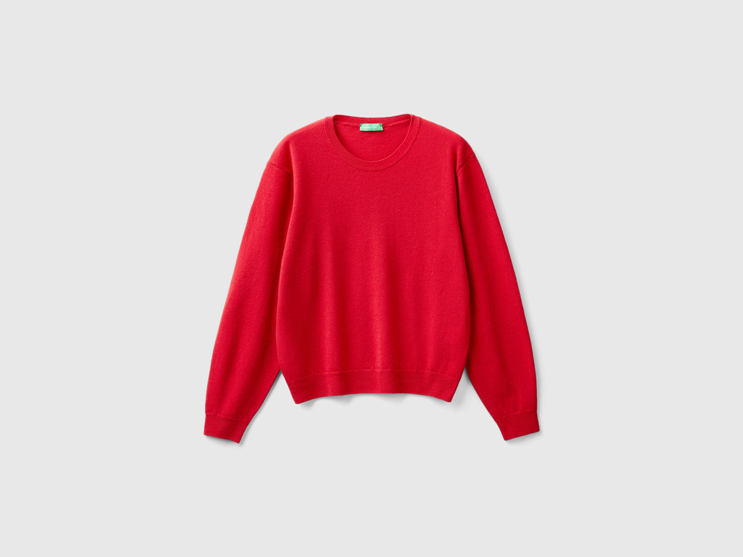 Maglia relaxed fit in pura lana Merino da donna rosso | Benetton Outlet
