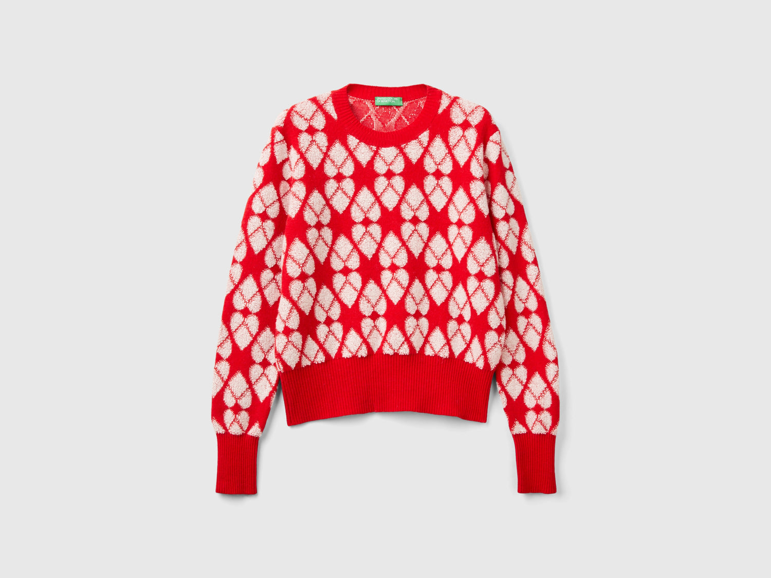 Maglione a cuori in misto lana riciclata da donna rosso | Benetton Outlet