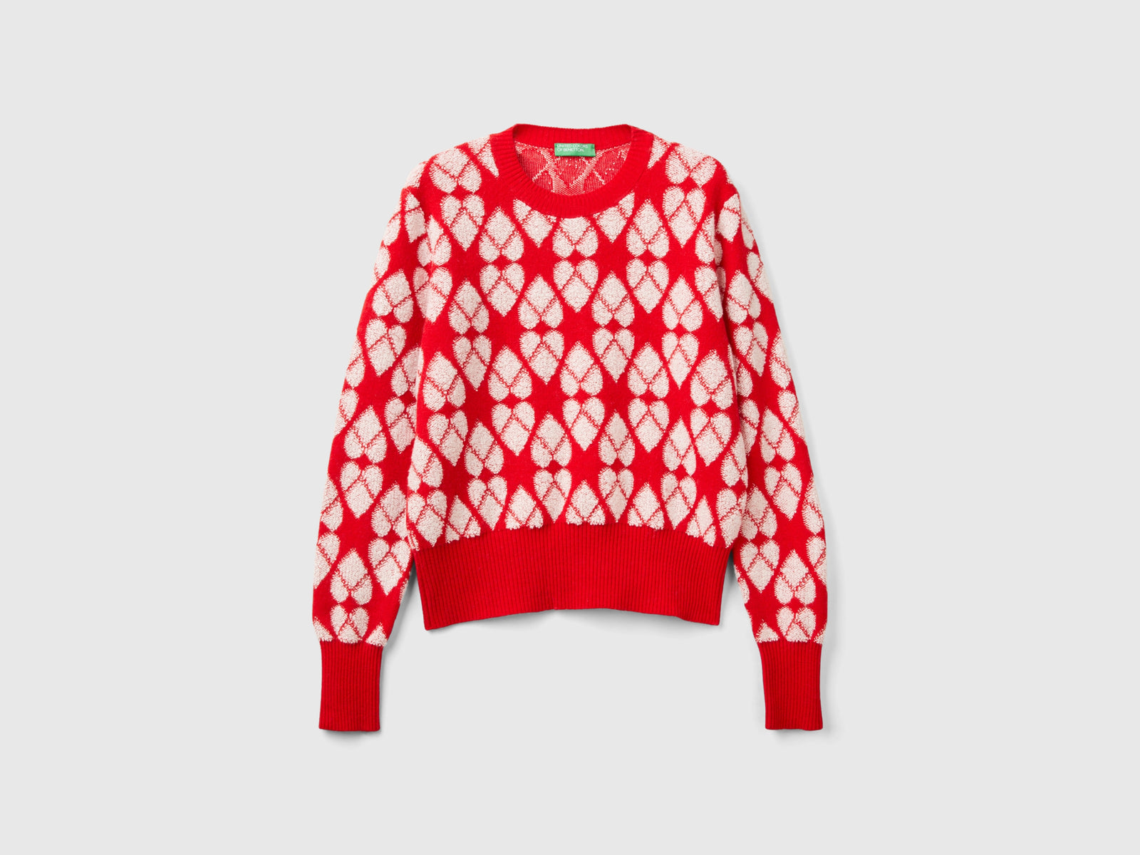 Maglione a cuori in misto lana riciclata da donna rosso | Benetton Outlet