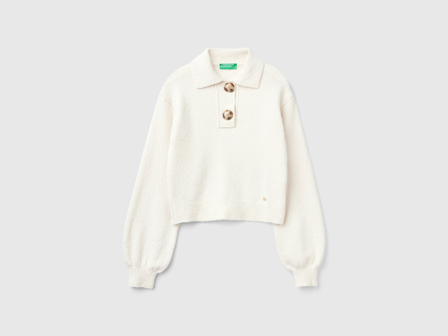 Polo in maglia cropped da donna bianco panna | Benetton Outlet