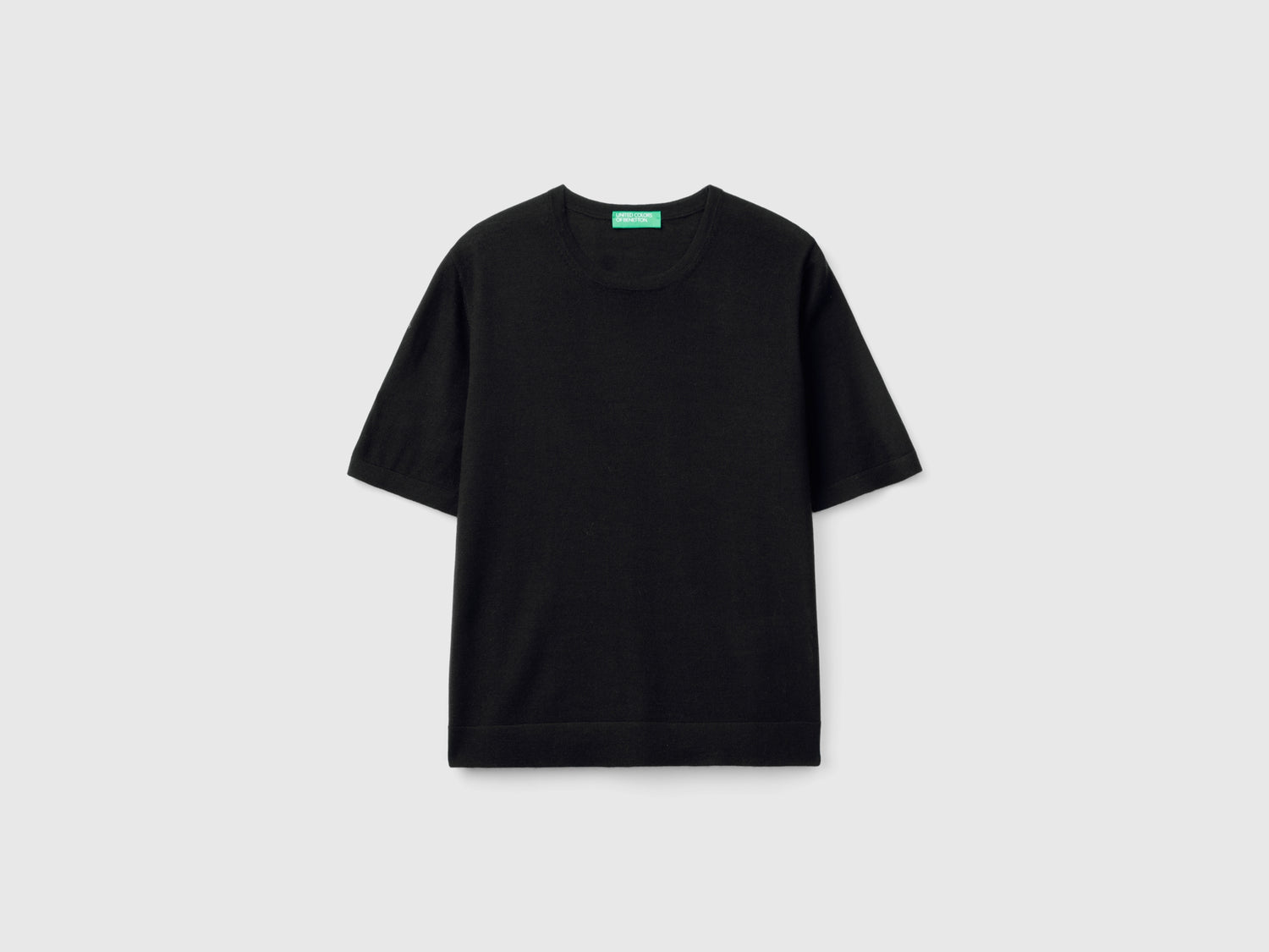 Maglia manica corta in pura lana Merino da donna nero | Benetton Outlet