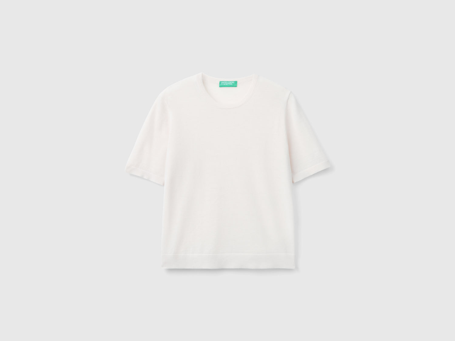 Maglia manica corta in pura lana Merino da donna rosa pastello | Benetton Outlet