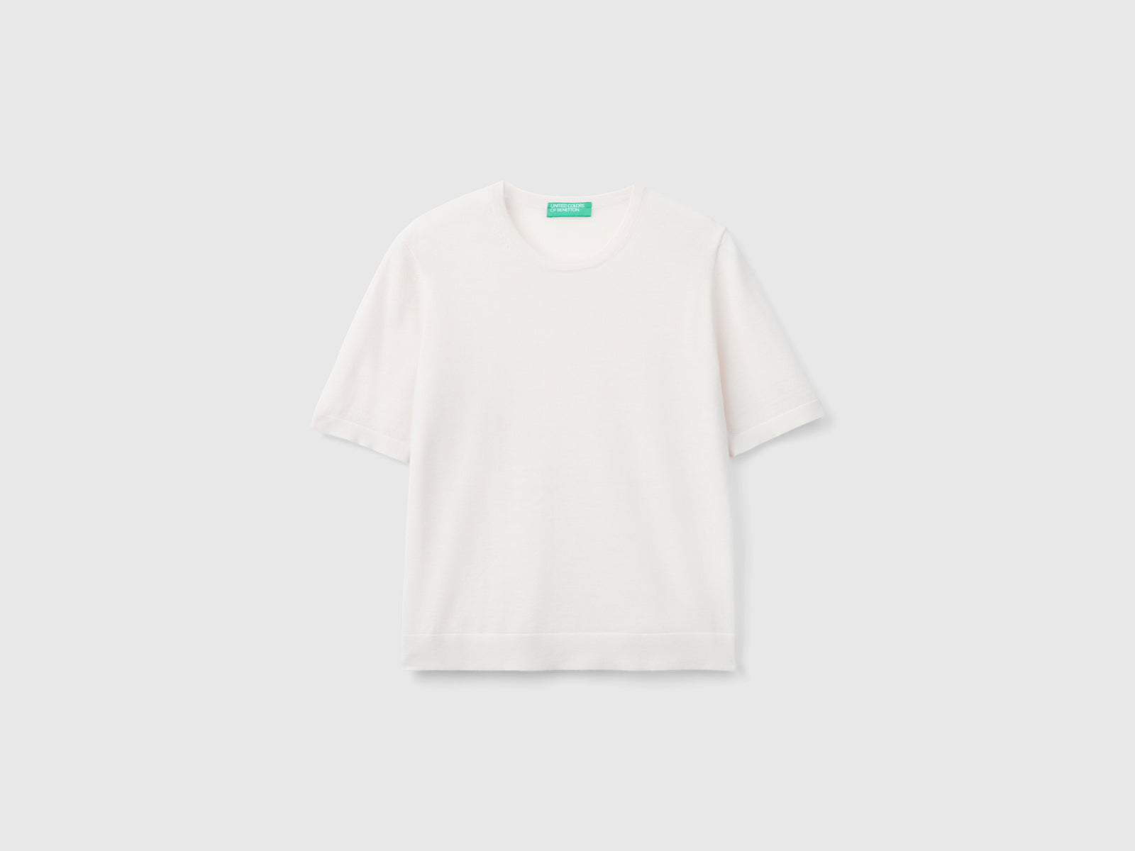 Maglia manica corta in pura lana Merino da donna rosa pastello | Benetton Outlet