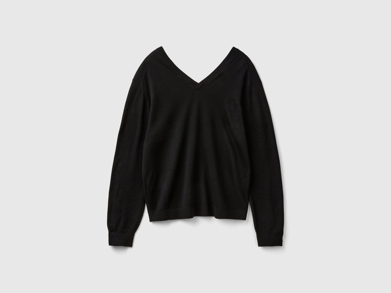 Maglia scollo a V in pura lana Merino da donna nero 2 | Benetton Outlet