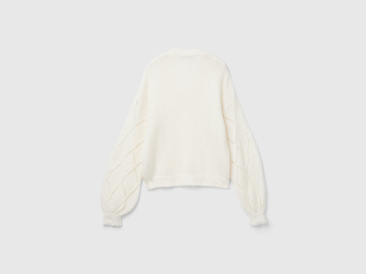 Maglione con manica traforata