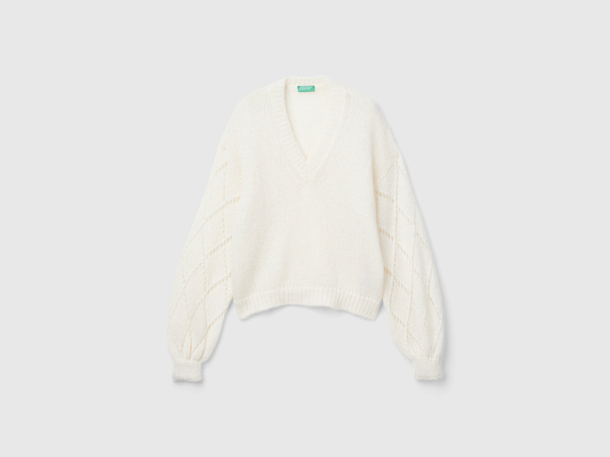 Maglione con manica traforata