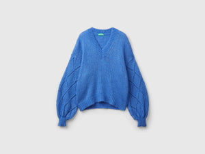 Sweater with perforated sleeves