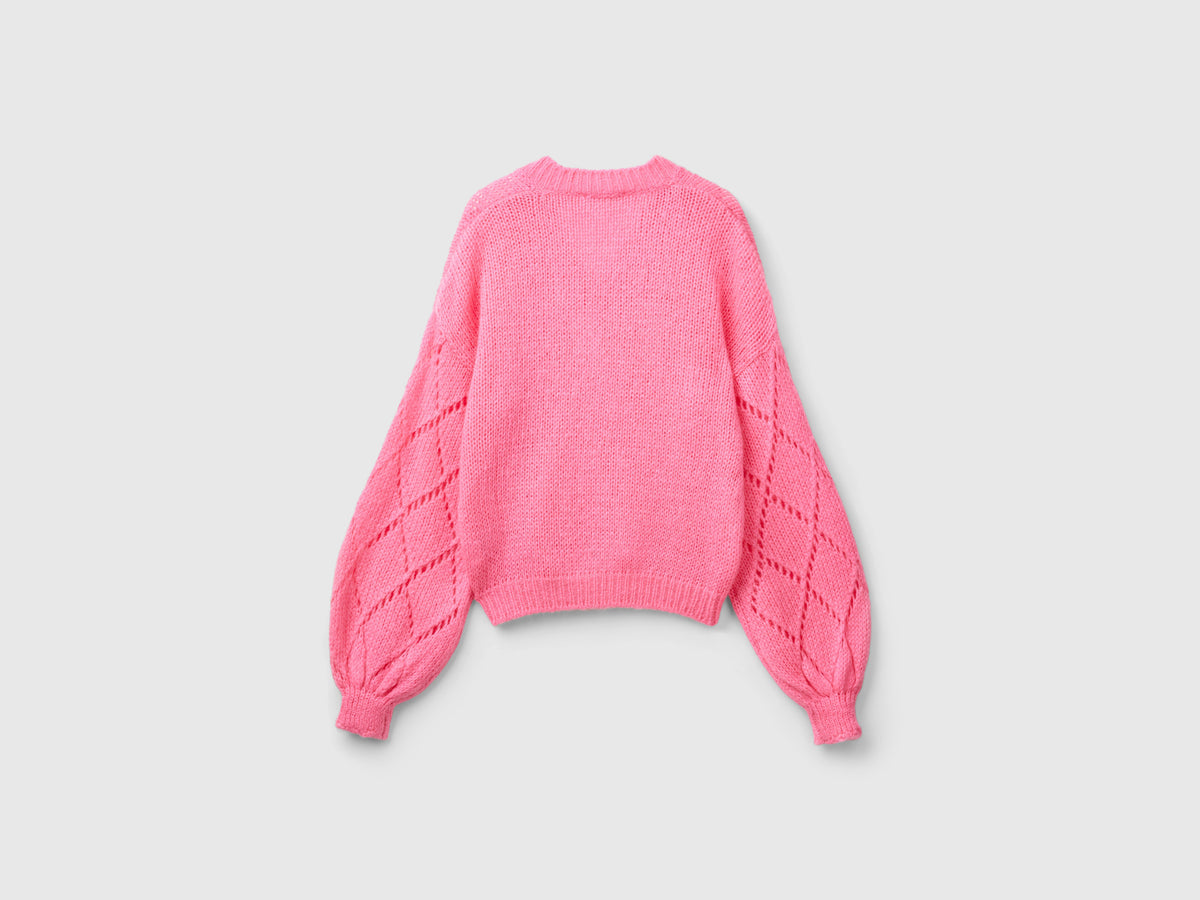 Sweater with perforated sleeves