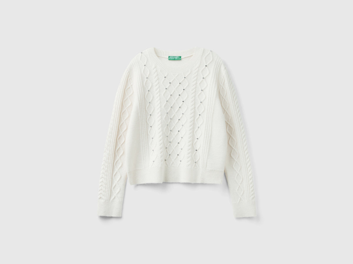 Sweater with braids and rhinestones