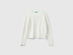 Sweater with braids and rhinestones