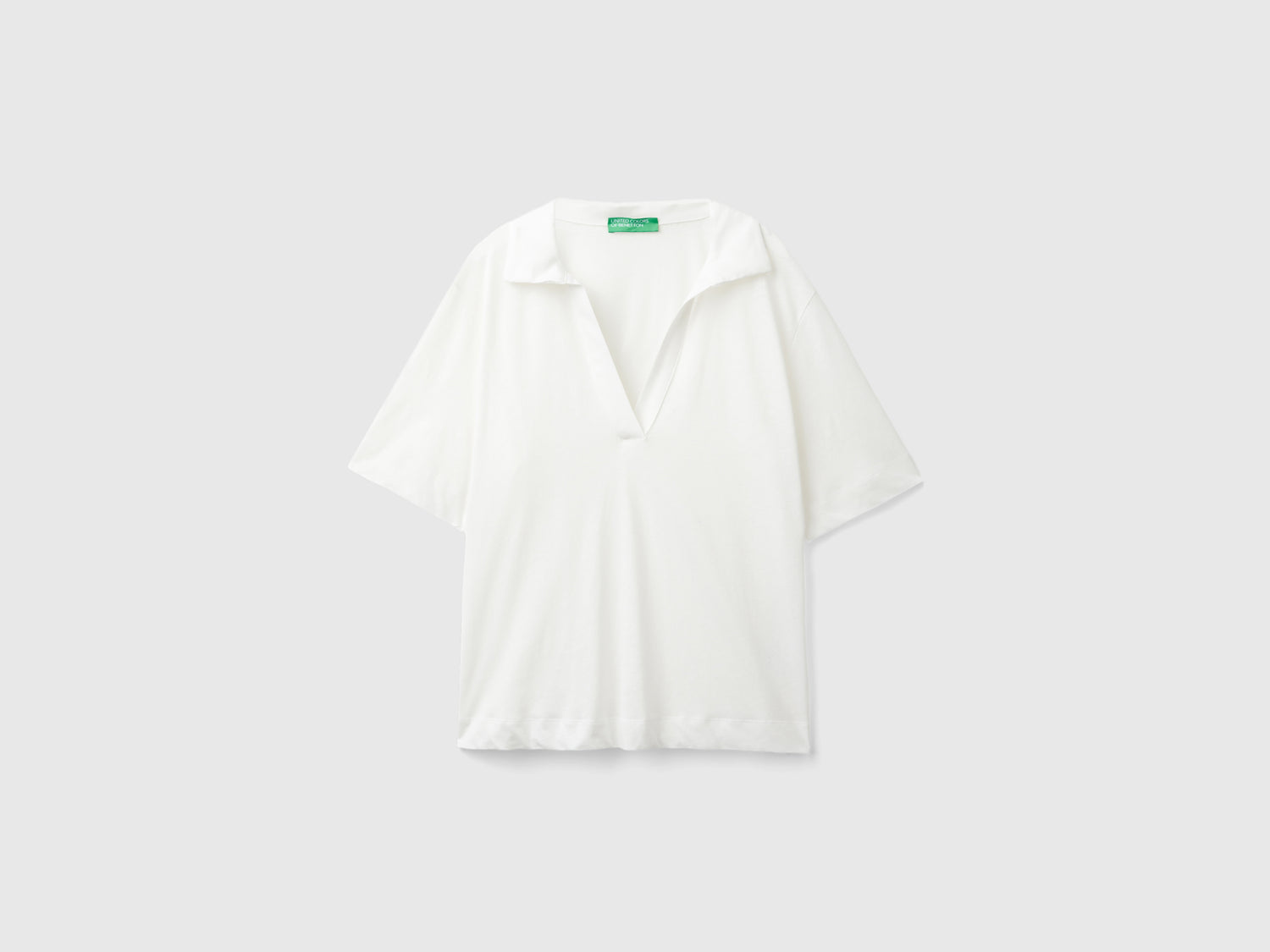 Polo in misto cotone e lino da donna bianco panna | Benetton Outlet