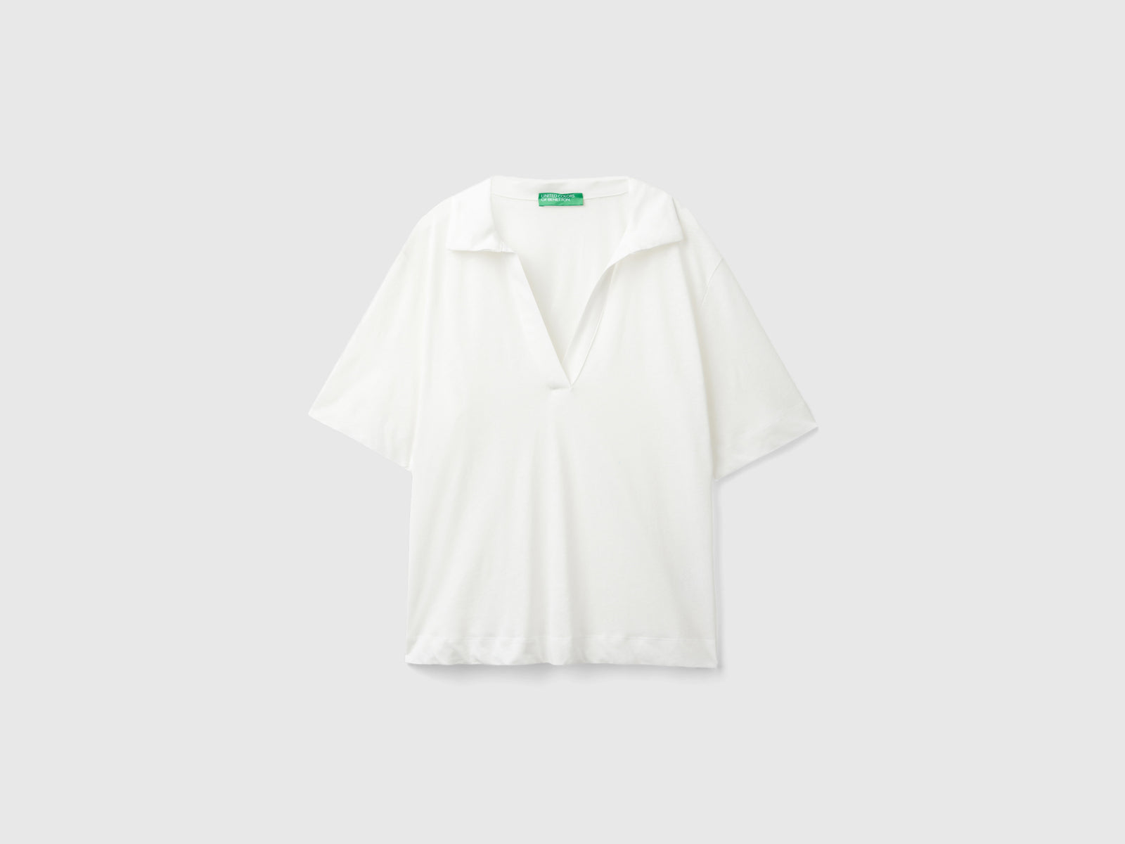 Polo in misto cotone e lino da donna bianco panna | Benetton Outlet