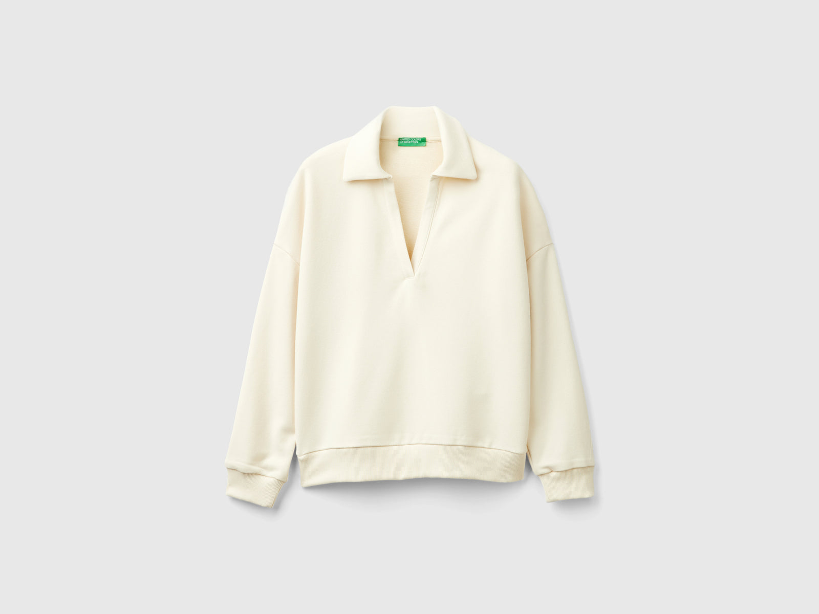 V-neck sweatshirt polo da donna bianco panna | Benetton Outlet