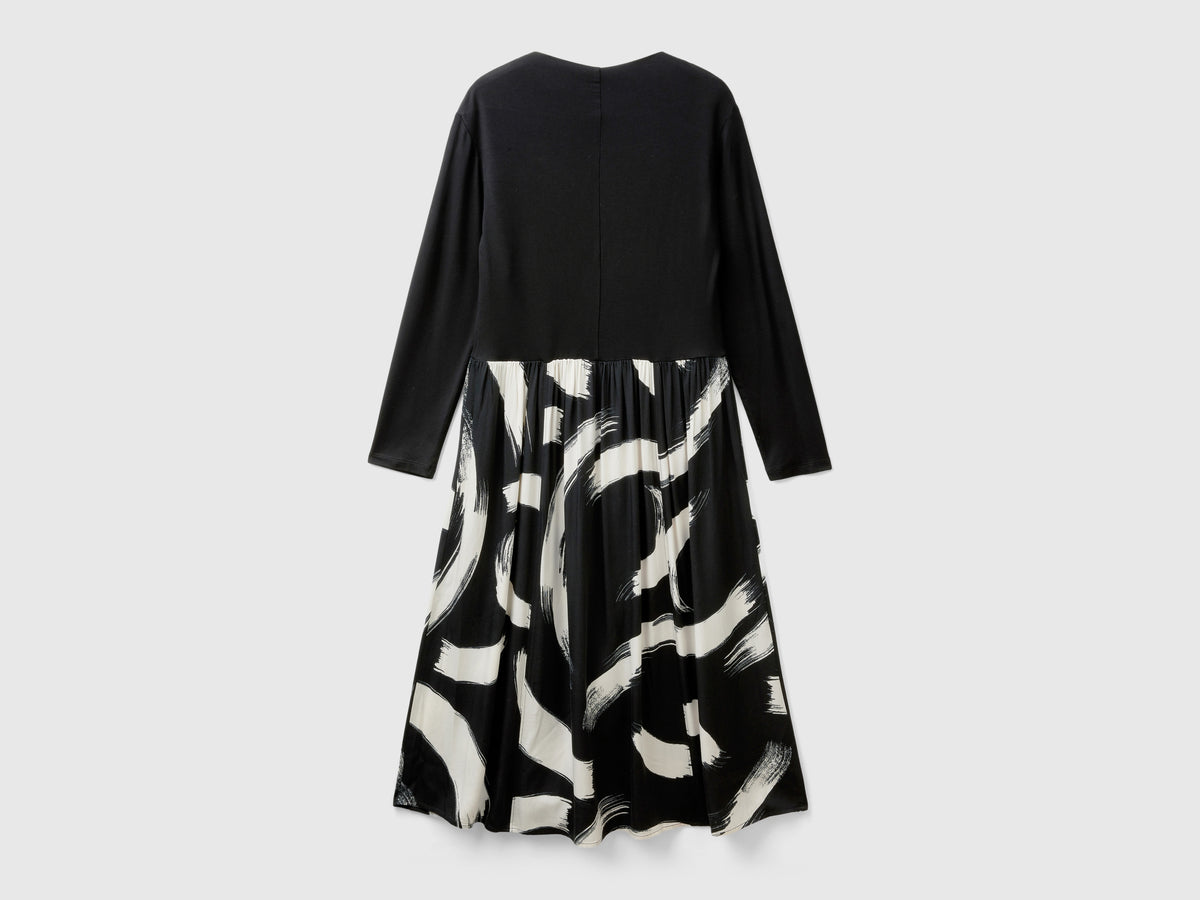 Vestito fluido con gonna fantasia