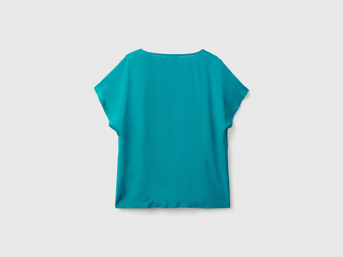 Blusa fluida a manica corta