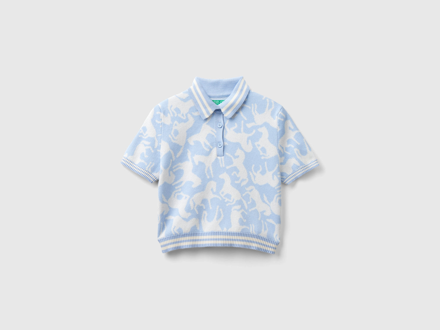 Polo cropped con cavalli da donna celeste | Benetton Outlet