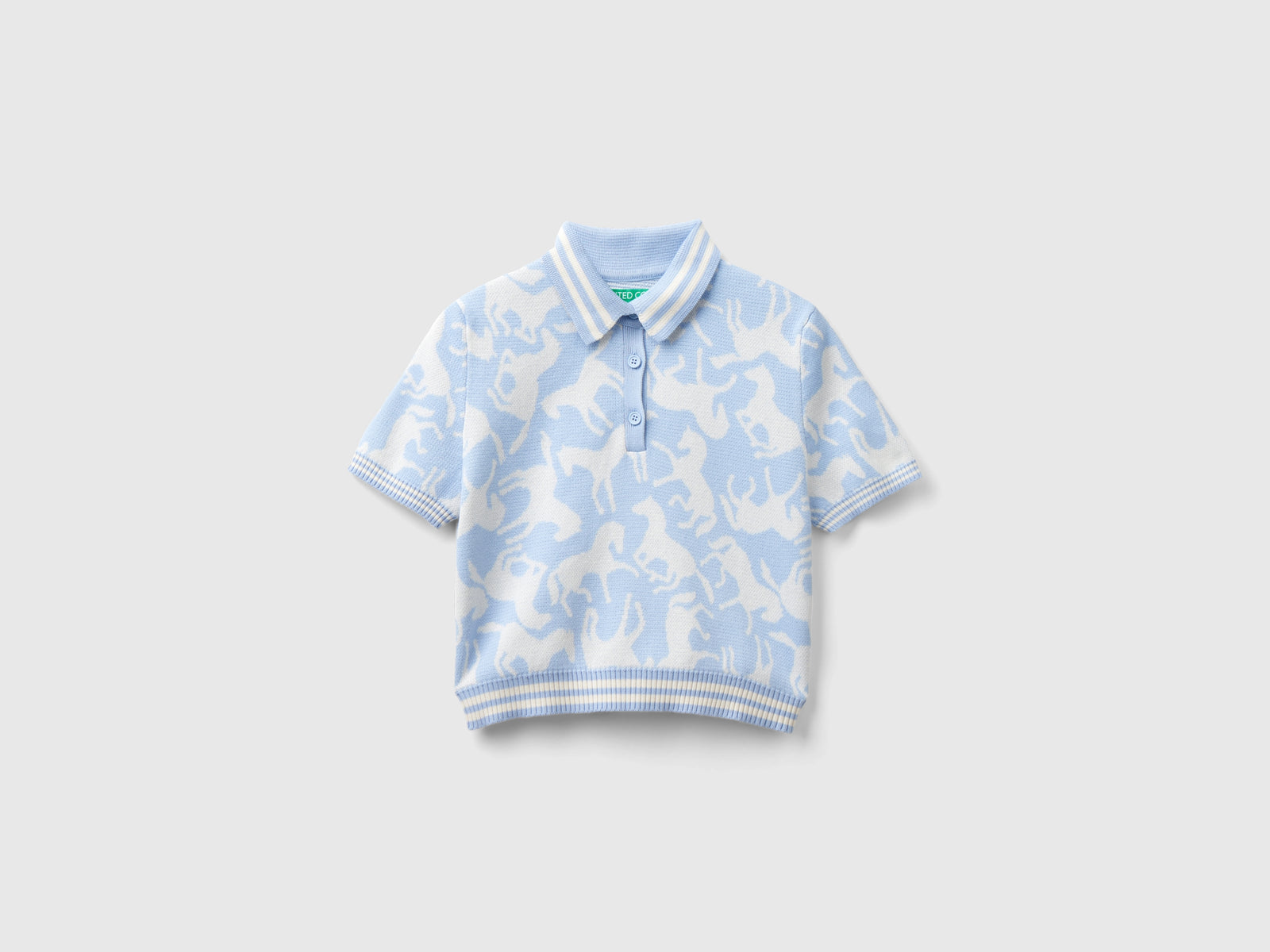 Polo cropped con cavalli da donna celeste | Benetton Outlet